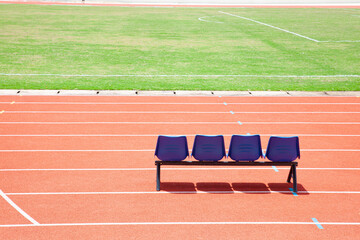 Blue reserve chair bench for staff, coach, substitutes players bench in outdoors sport stadium