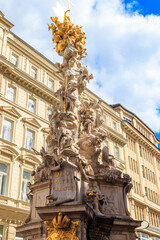 Fototapeta na wymiar The Plague Column, or Trinity Column, is a Holy Trinity column located on the Graben, a street in the inner city of Vienna, Austria