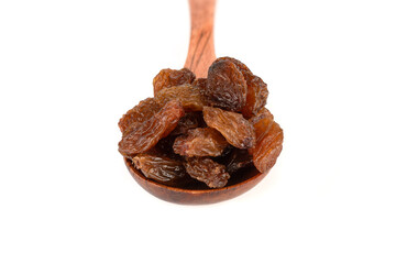 Wooden spoon with sweet pitted on a white background.