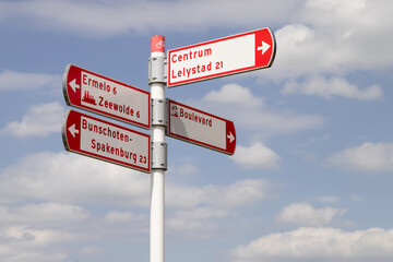 Signage pole in the city of Harderwijk to various destinations in the area.