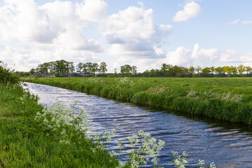 The river - De Barneveldse beek, flows gently through the dutch landscape.