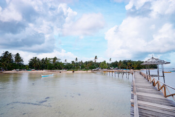 Beautiful landscape. Wooden bridge on the beach, Siargao Island, Philippines.