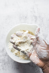 butter and flour being mixed together, butter and flour mixed into rough pastry, butter and flour being used to make cookie dough or pie dough, process of making cut out sugar cookies