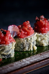 Delicious uramaki sushi rolls with raw tuna
