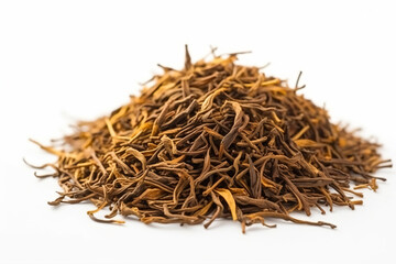 a pile of dried tea leaves on a white surface