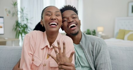 Video call, engagement ring and announcement with an excited black couple on a sofa in their living room. Love, jewelry or good news of marriage with a man and woman laughing in their home together