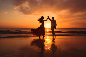 Couple dancing on a beach at sunset
