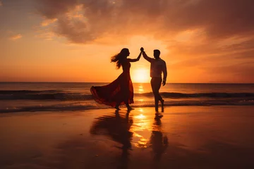 Fotobehang Couple dancing on a beach at sunset © Trendy Graphics