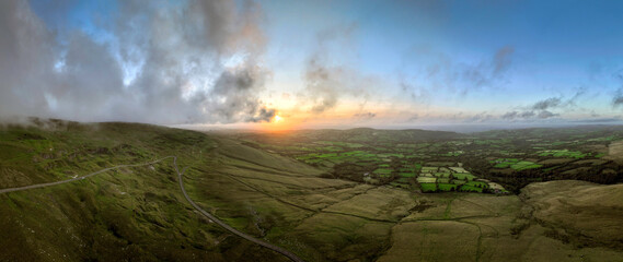 Sunset over the western edge of the Black Mountain in Carmarthenshire, South Wales UK
 - Powered by Adobe