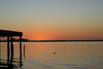Fototapeta na wymiar Mirrored Sunset Pier