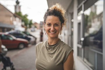 Portrait of adult caucasian woman stand in town or city outdoor in day © Miljan Živković