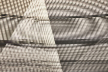 Abstract art of mesh with lines and triangles of light though fabric like material
