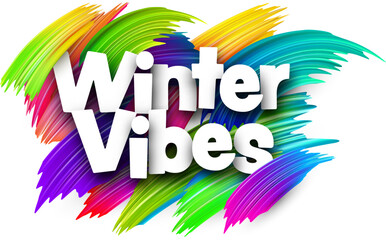 Winter vibes paper word sign with colorful spectrum paint brush strokes over white. Vector illustration.