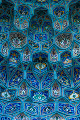 Close-up view of beautiful mosaic decorated blue portal of old Saint Petersburg Mosque. Abstract textured religious architecture background. Soft focus. Copy space for your text. Muslim culture theme.