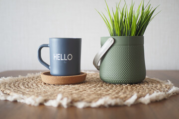 blue coffee cup with hello word