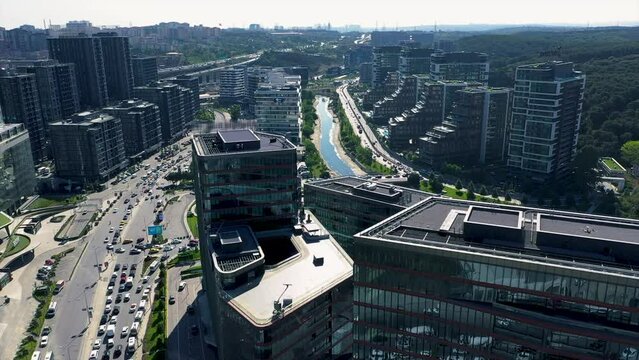4k aerial shot of an area with skyscrapers, car traffic, river and forest. Istanbul, Turkey. Stock Video