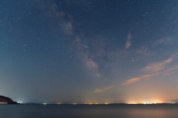 Fototapeta na wymiar Beautiful night landscape, bright Milky Way galaxy on the lake.