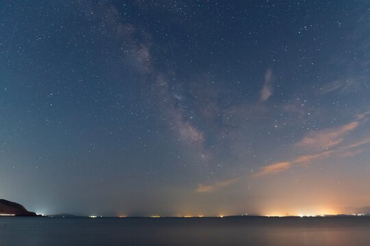 Beautiful night landscape,  bright Milky Way galaxy  on the lake.