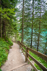 Path for walking around the Braies lake or Pragser Wildsee in the Dolomites, South Tyrol, Italy
