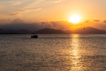 Fototapeta na wymiar Sunset at Aegean sea at Evia island in Greece