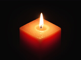 lone candle burning in dark