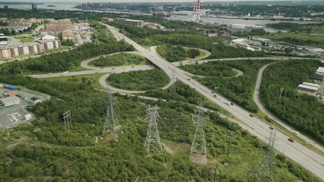 Aerial View of Vehicles Moving Through the Freeway Junction System in Dartmouth, Nova Scotia, Canada. Aerial Shot of Elevated Road Junction. Drone Footage of Highway Road Junctions. 