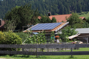 Fototapeta na wymiar house panels on the roof of a private house with solar panels on the roof, the concept of renewable energy