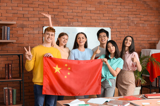 Young students with Chinese flag at language school
