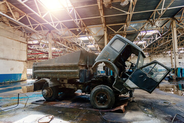 Fototapeta na wymiar Dump truck in garage for repair