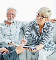 contract signing senior couple document investment business finance agent meeting agreement home