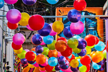 Fototapeta na wymiar Colorful hanging balloon balls at Ghirardelli Square close up