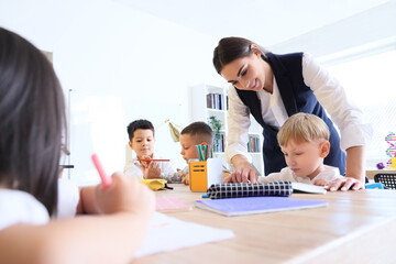 Female teacher conducting lesson in classroom