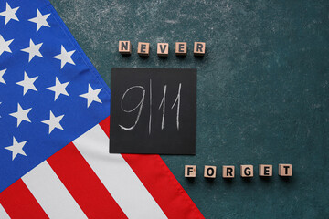 Fototapeta na wymiar USA flag and card with date of National Day of Prayer and Remembrance for the Victims of the Terrorist Attacks on grunge green background