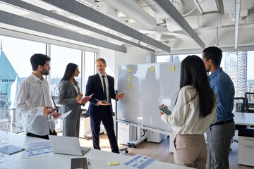 Busy professional diverse team business people coworkers working on corporate strategy in office...