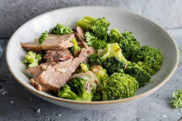 Meat chunks with vegetables on plate