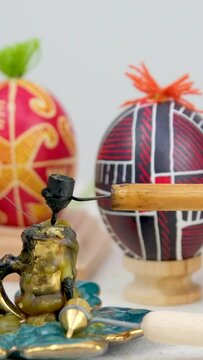 Pysanky are raw eggs painted with beeswax and paints that are given to each other for Easter dip a steel pen into hot wax on a raw cold egg to draw patterns Pen for painting Easter eggs with wax