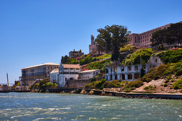East side of Alcatraz Island close up with prison on bright summer day