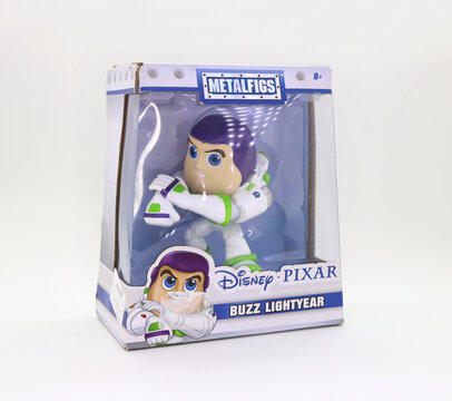 
Buzz Lightyear doll box in its original MetalFigs packaging. Superhero from the Disney Pixar Toy Story movie. Collectible children's toy in its box on white background. Product for sale in toy stores