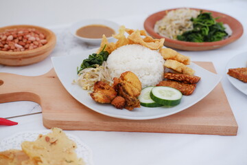 Thai food with rice, fried tofu, shrimp paste, sweet and sour sauce