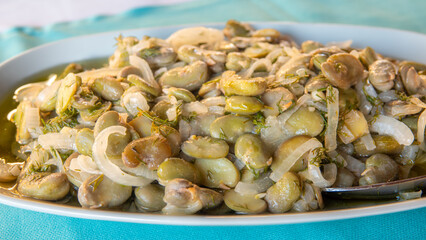 Traditional Turkish food; Fresh broad bean salad with olive oil, broad beans, onion and dill (Turkish name; iç bakla) Mediterranean style fava beans.
