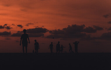 silhouette of people on the beach