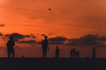 Fototapeta na wymiar Beach Football at Dusk