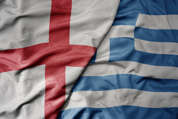 big waving national colorful flag of england and national flag of greece .