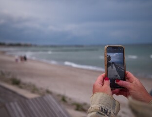 Mobile phone portrait by the sea.