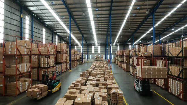 Timelapse Warehouse Lift Trucks Stacking Boxes