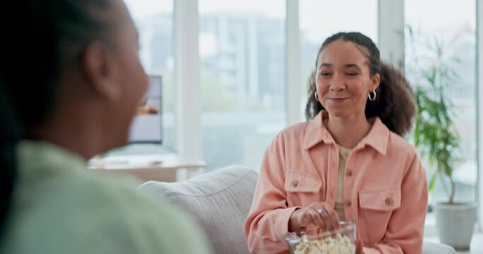 Happy, woman and popcorn catch in mouth in living room, apartment or friends in house together on sofa or couch. Playing, fun trick and person winning with smile, laugh and eating food or snack
