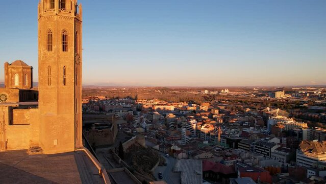 View from drone of Catalan city of Lleida with old medieval 13th century Cathedral of St Mary of La Seu Vella is symbol of reconquista, typical gothic architecture style, iconic monument, Spain. 4K