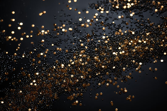 Gold glitters on black background