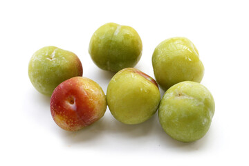 Fresh green plum on white background