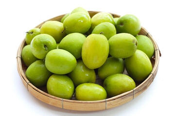 Green jujube fruits on white background.